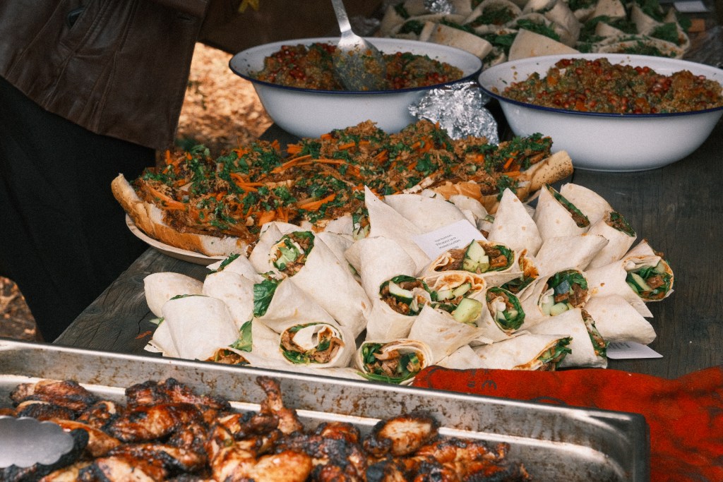 Seeds of Wild cooking up a mouthwatering feast - wraps, chicken, sandwiches and salads.